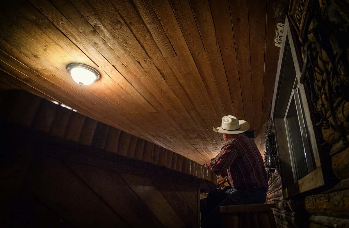 idaho man sitting on chair while looking up night